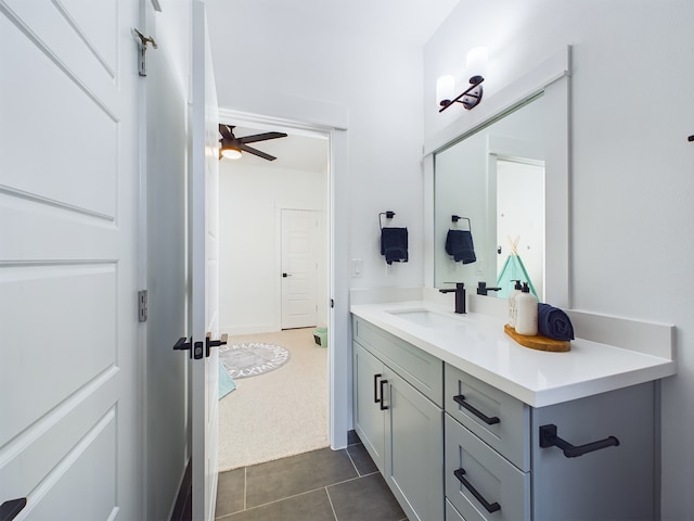 bathroom with tile patterned floors, ceiling fan, and vanity