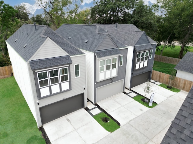 view of front of home with a garage and a front yard