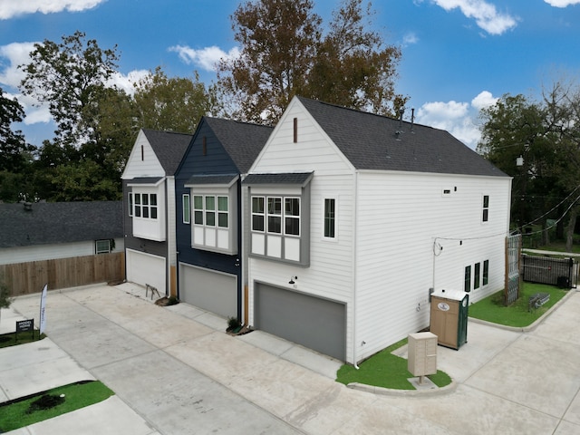 back of house featuring a garage