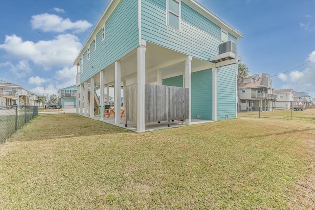 view of property exterior featuring a garage, a yard, and a patio