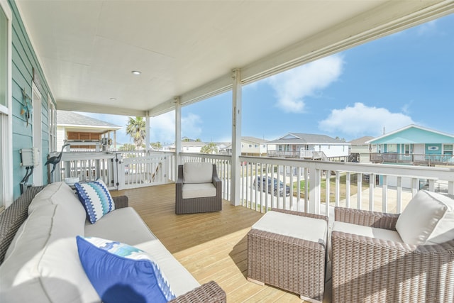 wooden terrace with outdoor lounge area