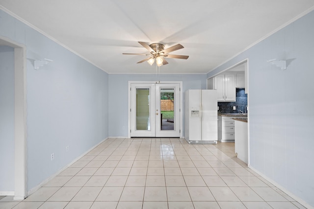 kitchen featuring ceiling fan, decorative backsplash, white fridge with ice dispenser, ornamental molding, and white cabinetry