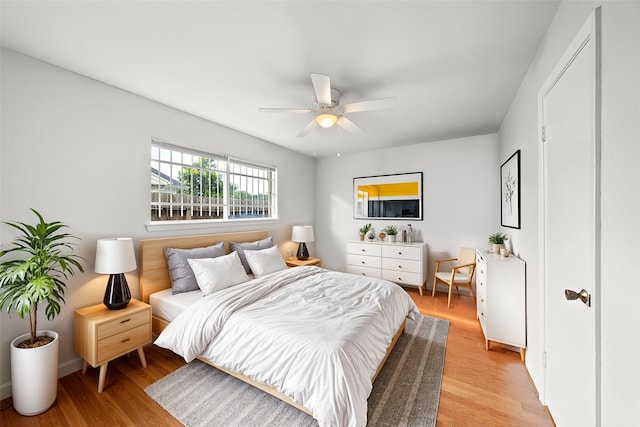 bedroom featuring ceiling fan and light wood-type flooring