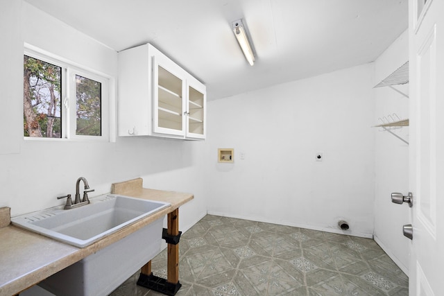 laundry room with hookup for an electric dryer, washer hookup, and sink