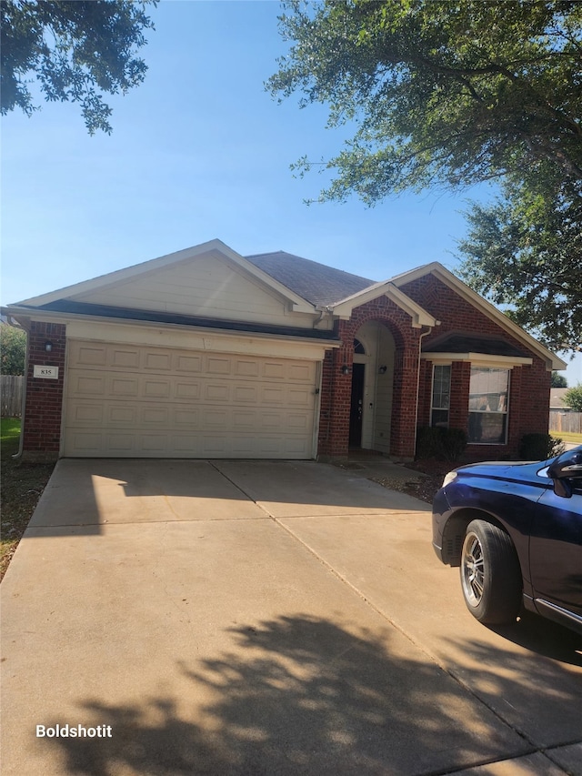 single story home with a garage