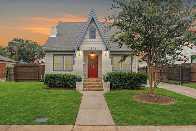 view of front of home featuring a yard