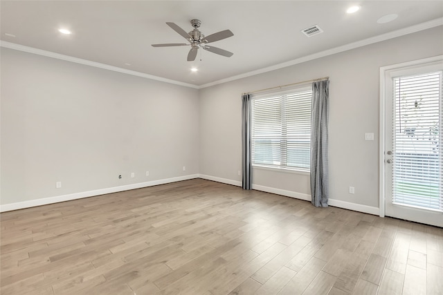 empty room featuring crown molding, light wood-type flooring, and ceiling fan