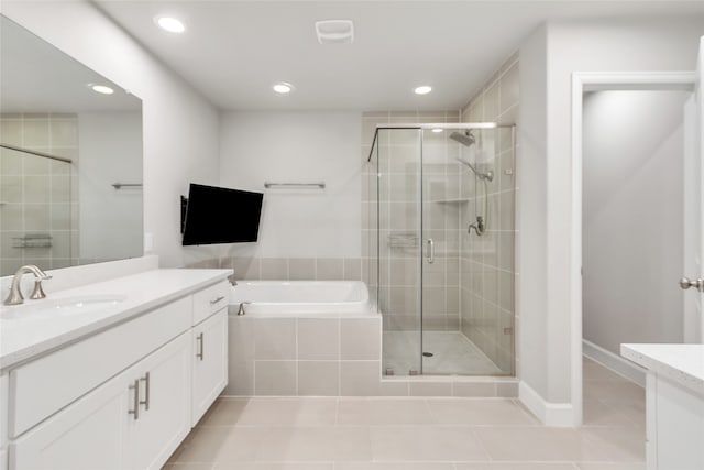 bathroom with vanity, independent shower and bath, and tile patterned flooring