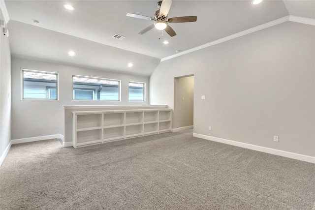 unfurnished living room featuring lofted ceiling, crown molding, and carpet floors