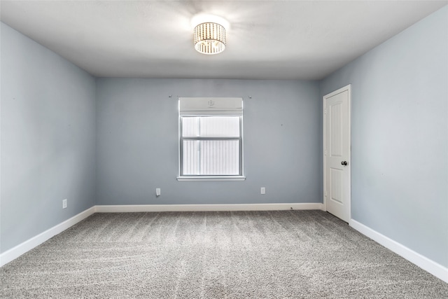 unfurnished room featuring carpet flooring