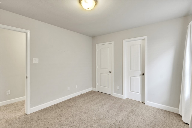 unfurnished bedroom featuring carpet