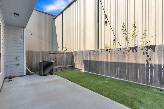 view of yard with a patio and cooling unit