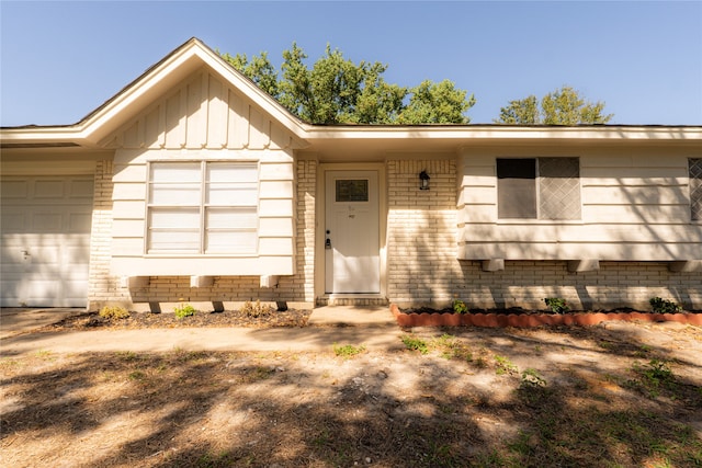 entrance to property featuring a garage