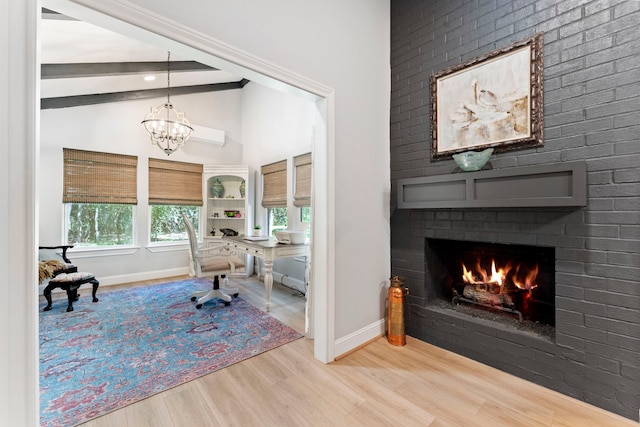 office featuring a fireplace, plenty of natural light, vaulted ceiling, and wood-type flooring