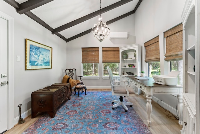 office area featuring light hardwood / wood-style floors, beam ceiling, an inviting chandelier, and a healthy amount of sunlight