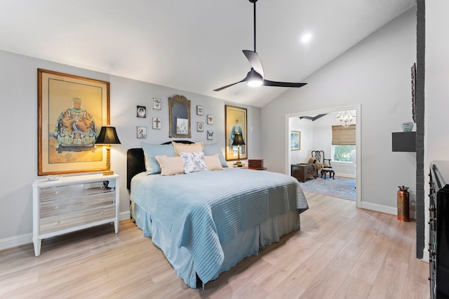 bedroom with light wood-type flooring, ceiling fan, and vaulted ceiling