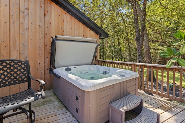 deck featuring a hot tub