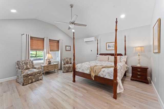 bedroom featuring an AC wall unit, light wood-type flooring, ceiling fan, and lofted ceiling