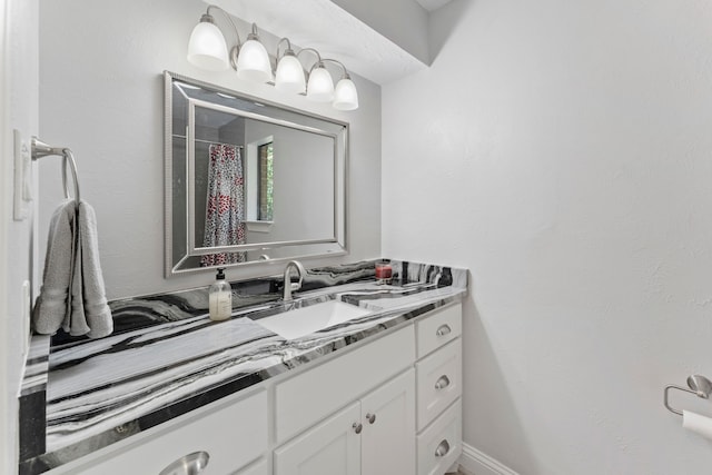 bathroom with vanity and a shower with shower curtain