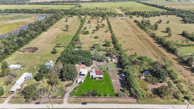 birds eye view of property featuring a rural view and a water view