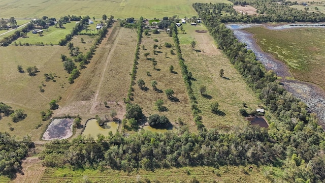 aerial view featuring a water view and a rural view