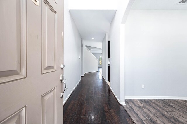 12915 Madison Boulder Ln, Humble, TX 77346 - hall with arched walkways, recessed lighting, baseboards, wood finished floors, and visible vents
