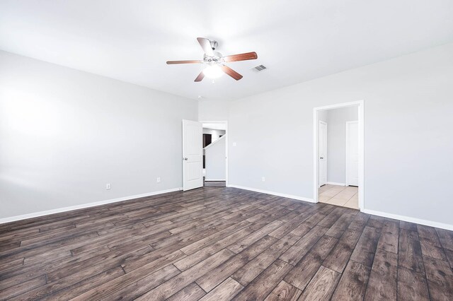 12915 Madison Boulder Ln, Humble, TX 77346 - unfurnished room with a ceiling fan, baseboards, visible vents, and wood finished floors