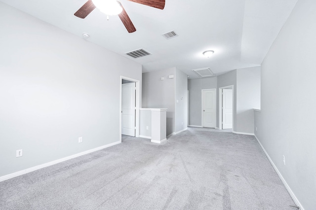 carpeted empty room featuring lofted ceiling and ceiling fan