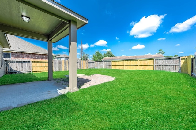 12915 Madison Boulder Ln, Humble, TX 77346 - view of yard featuring a fenced backyard and a patio
