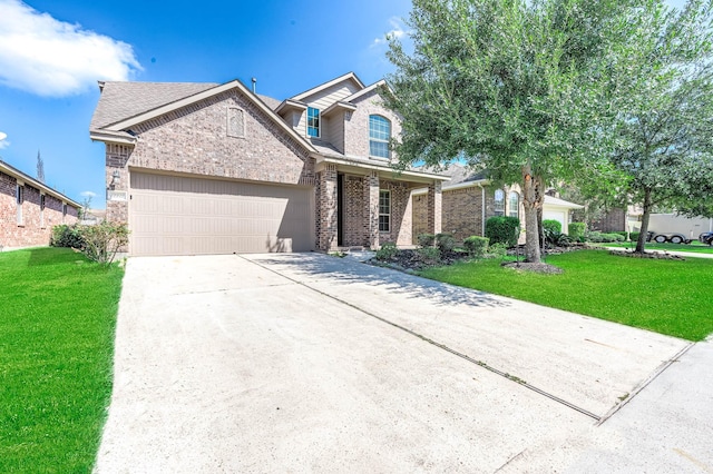 12915 Madison Boulder Ln, Humble, TX 77346 - traditional-style home with a garage, driveway, a front lawn, and brick siding