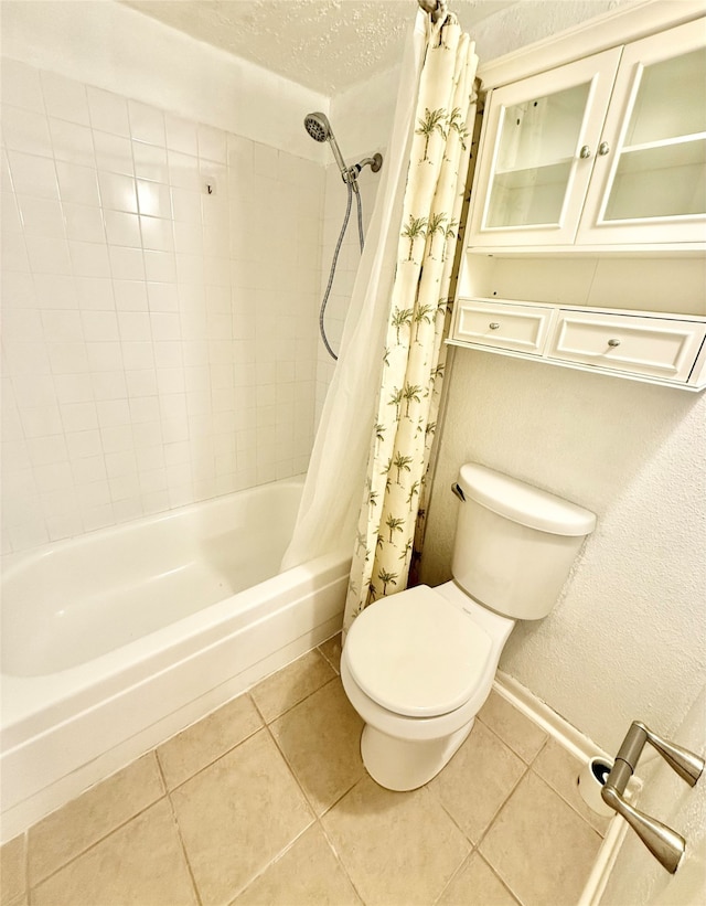 bathroom featuring shower / tub combo, a textured ceiling, toilet, and tile patterned flooring