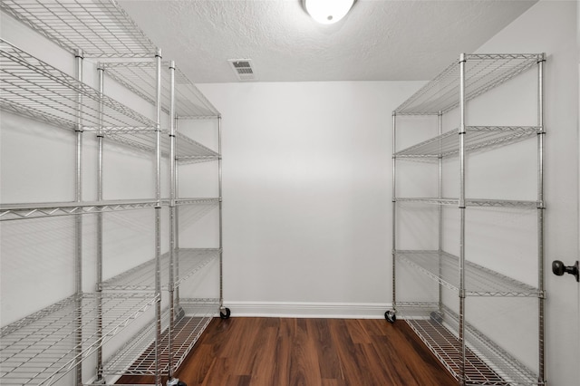 interior space featuring visible vents and wood finished floors
