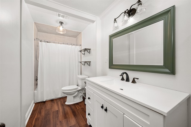 full bathroom featuring vanity, wood-type flooring, crown molding, toilet, and shower / tub combo with curtain