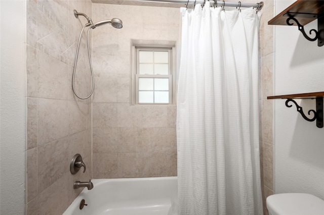 bathroom with shower / bathtub combination with curtain and toilet