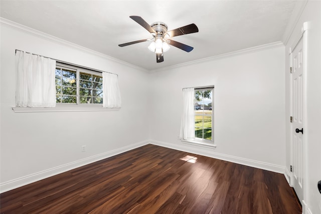 unfurnished room with crown molding, ceiling fan, and dark wood-type flooring