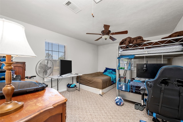 bedroom with ceiling fan and carpet flooring