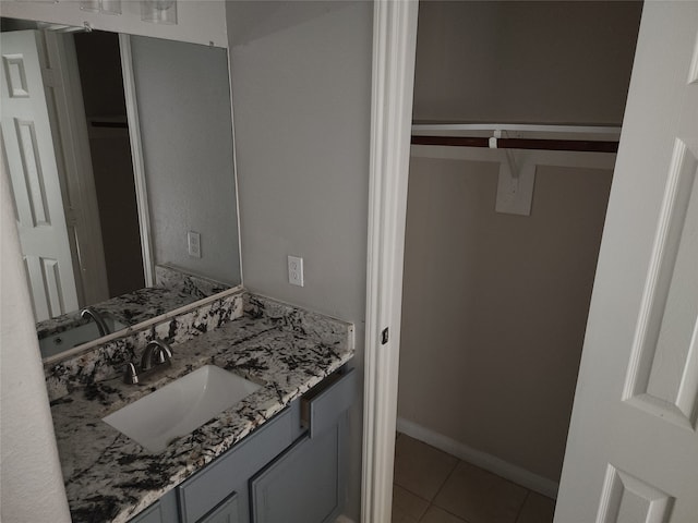 bathroom with tile patterned floors and vanity