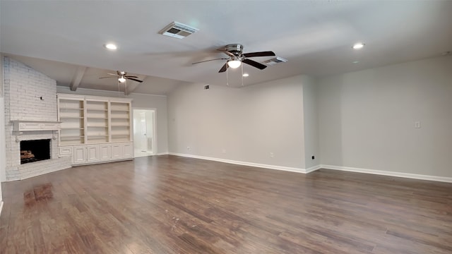 unfurnished living room featuring ceiling fan, a fireplace, vaulted ceiling with beams, and dark hardwood / wood-style flooring