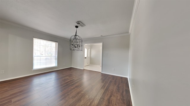 unfurnished dining area with an inviting chandelier, crown molding, and dark wood-type flooring