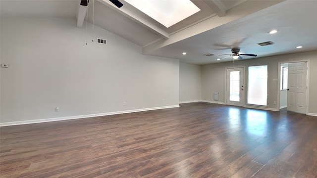 empty room featuring ceiling fan, vaulted ceiling with beams, and dark hardwood / wood-style floors