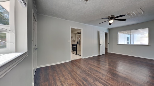 unfurnished room with dark wood-type flooring, crown molding, a textured ceiling, and ceiling fan