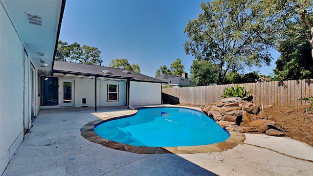 view of swimming pool featuring a patio