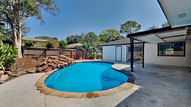 view of swimming pool with a patio