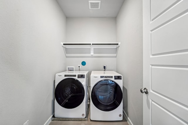 washroom featuring separate washer and dryer