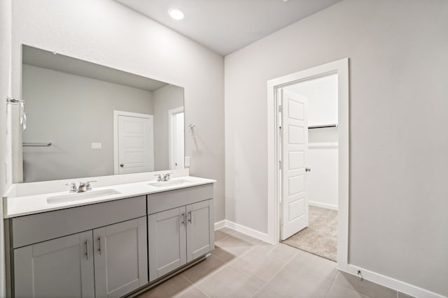 bathroom featuring tile patterned flooring and vanity