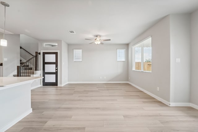 interior space featuring ceiling fan and light wood-type flooring