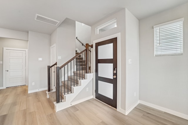 entryway with light hardwood / wood-style flooring