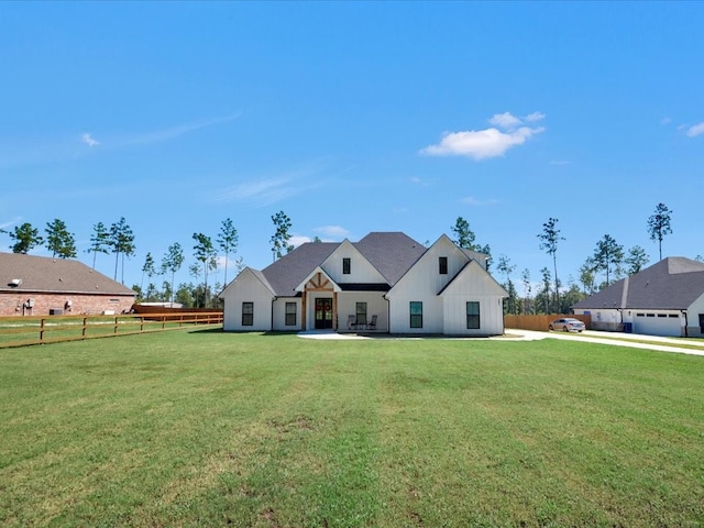 view of front of house featuring a front yard and a patio area