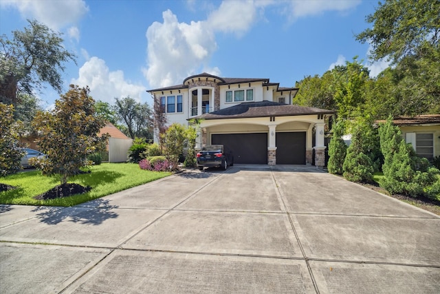 view of front of home featuring a garage and a front lawn