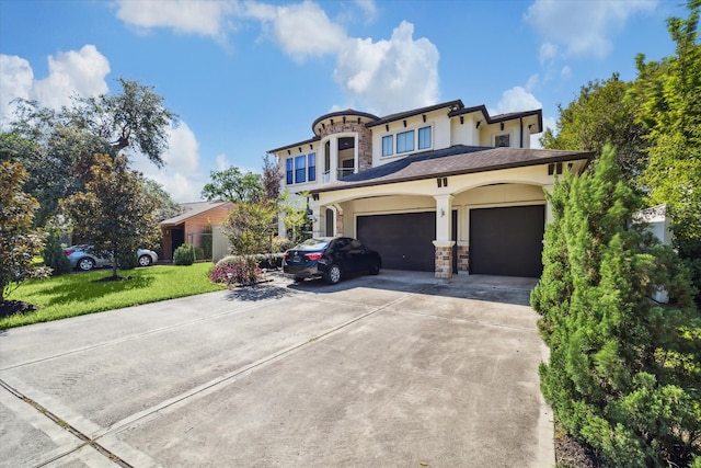 view of front of house with a front yard and a garage